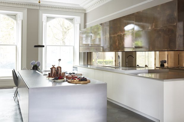 Roundhouse Urbo matt lacquer bespoke kitchen in Farrow & Ball Wimbourne White with wall cabinets in high gloss Burnished Bronze.jpg