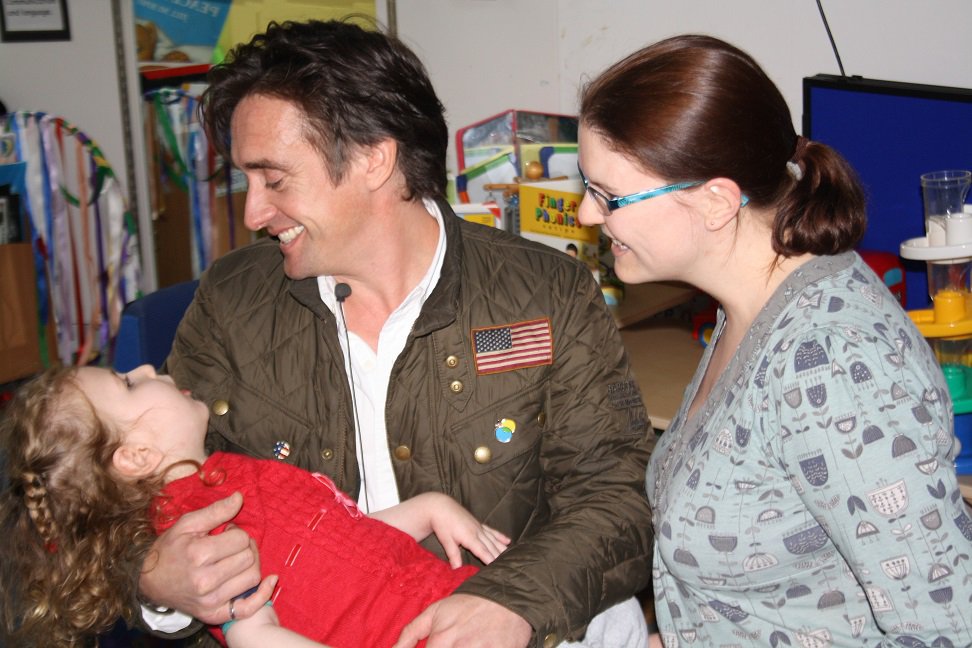 Richard meeting a little girl who is receiving rehabilitation for a brain injury, pictured here with her mum.jpg