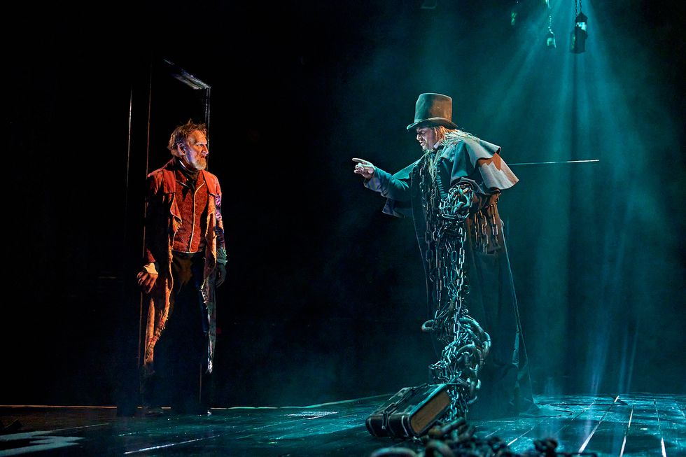 Christopher Eccleston as Ebenezer Scrooge and Andrew Langtree as Marley in A Christmas Carol at The Old Vic (2023), photo by Manuel Harlan.jpg